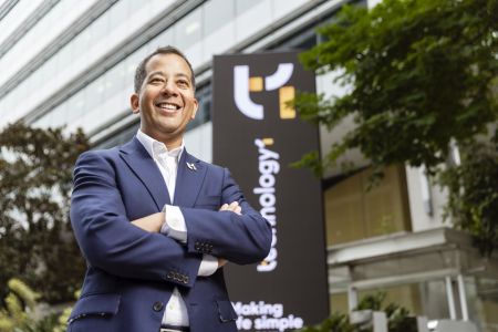 TechnologyOne CEO Ed Chung standing outside HQ office